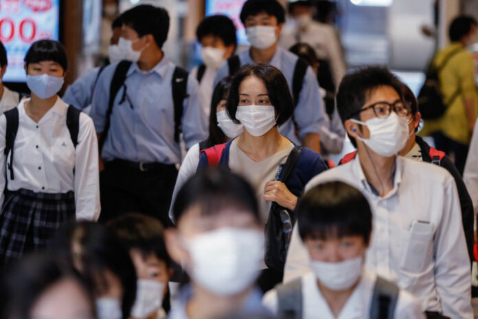 Students wearing face masks as a preventive measure make
