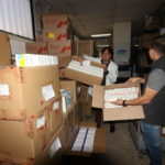 Ismael Sarmiento y Fabián Criollo, funcionarios del IESS en la bodega central (foto referencial)