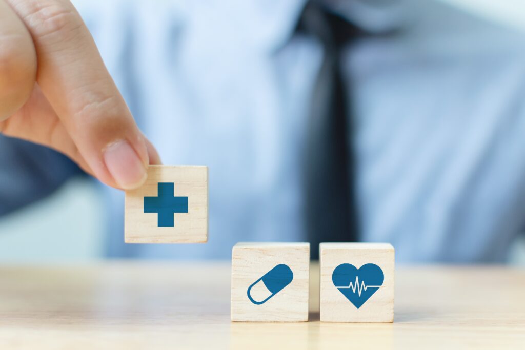 Hand,Arranging,Wood,Block,With,Icon,Healthcare,Medical,,Insurance,For thumbnail