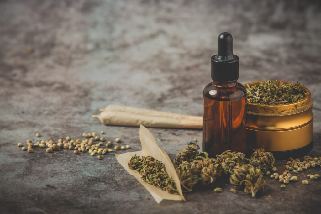 metal grinder weed,canabis oil and joint on gray background thumbnail
