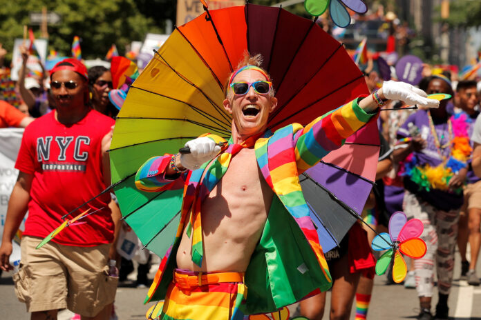 People march down 5th Avenue during the 2019 World Pride NYC and Stonewall 50th LGBTQ Pride Parade in New York