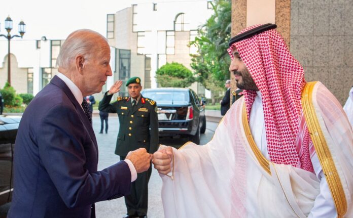 Saudi Crown Prince Mohammed bin Salman fist bumps U.S. President Joe Biden upon his arrival at Al Salman Palace, in Jeddah