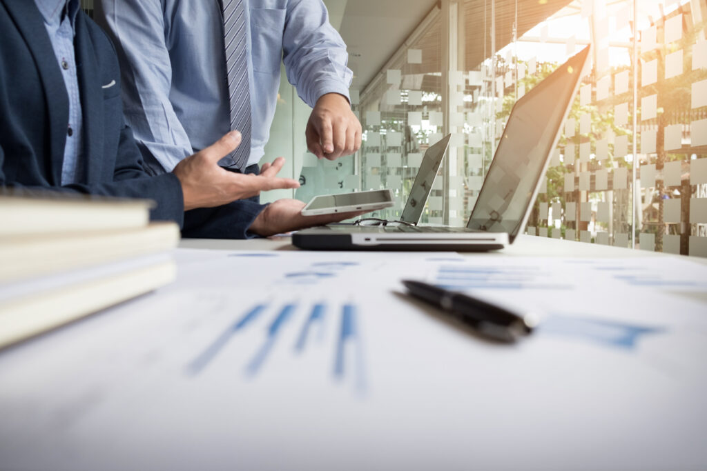 Business adviser analyzing financial figures denoting the progre thumbnail