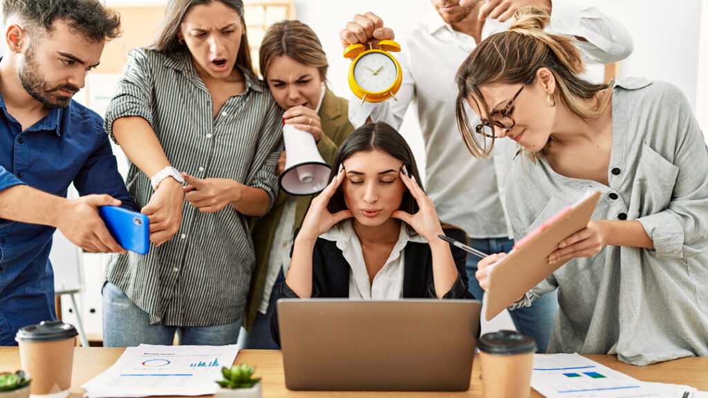 Group of business workers screaming to stressed partner at the office. thumbnail